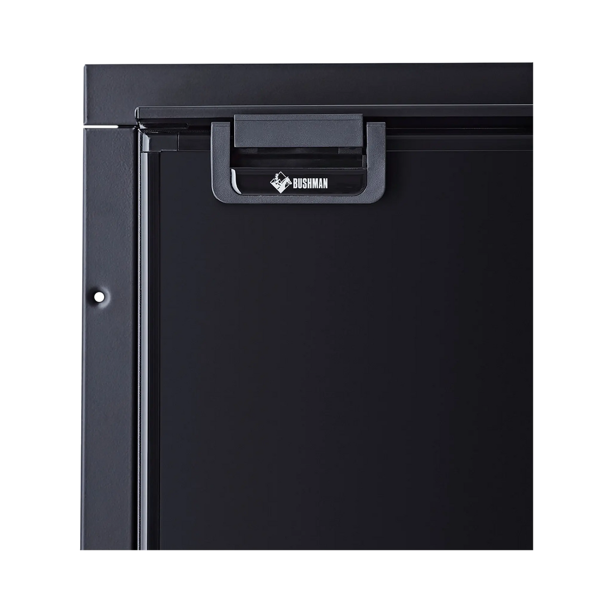 Bushman 130L black upright fridge close up of its black door latch and upper door frame.