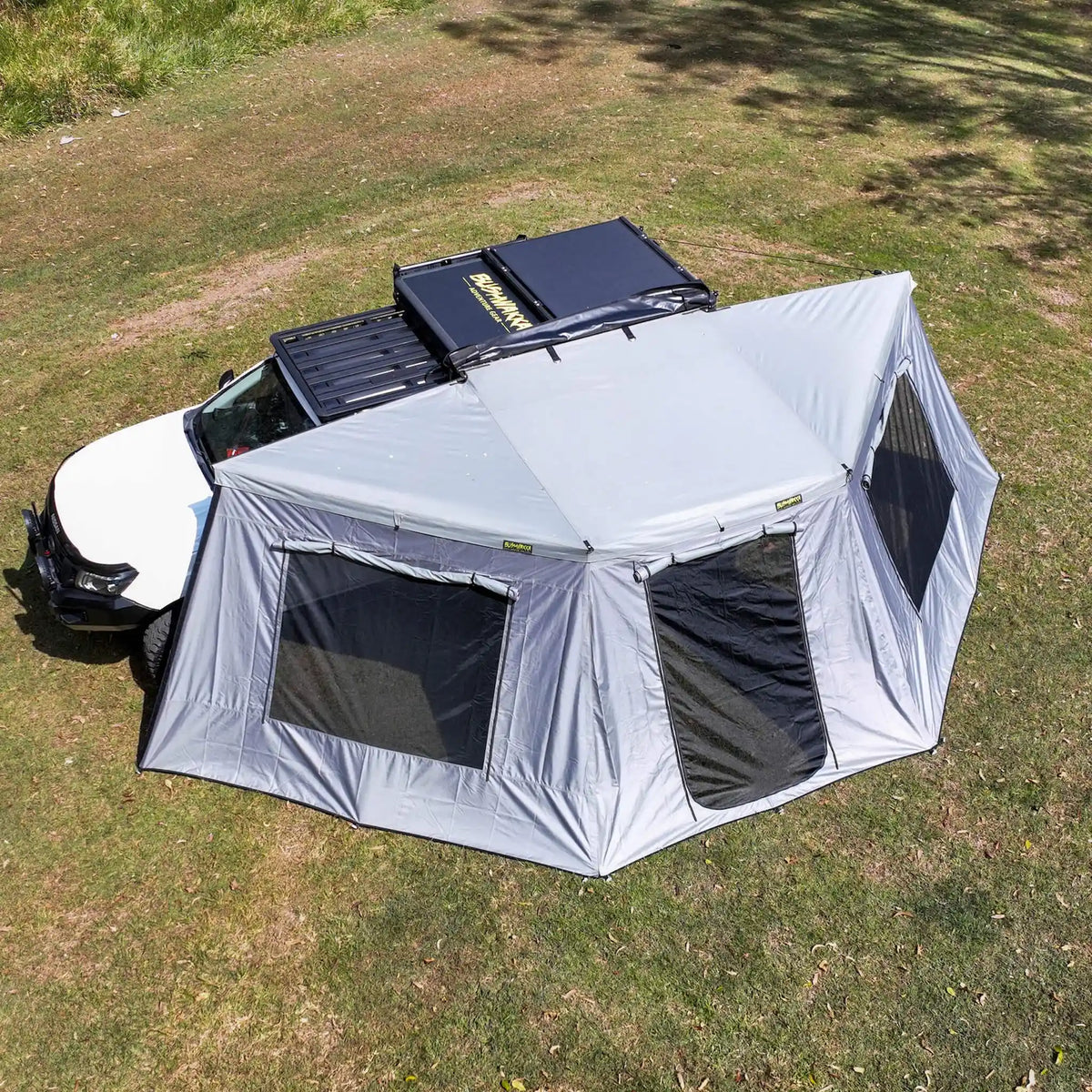 Bushwakka Extreme 180 awning wall kit overhead left installed view with windows open.