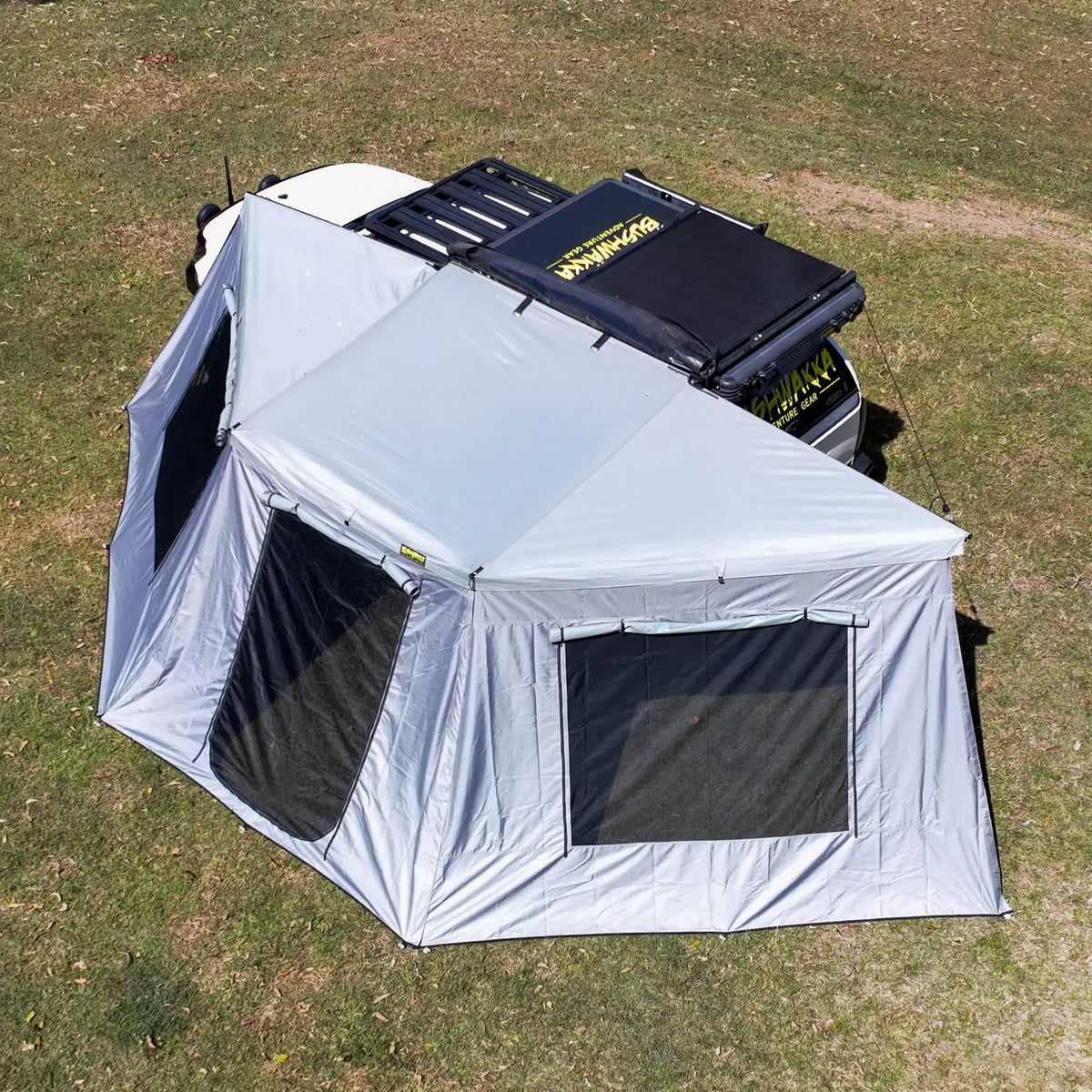 Bushwakka Extreme 180 awning wall kit overhead right installed view with doorway and windows open.