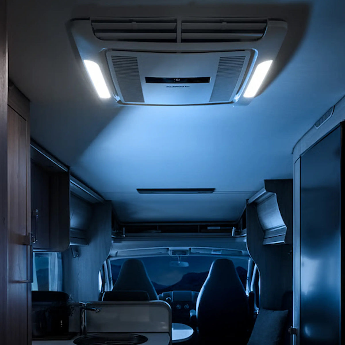 Dometic FreshJet Electronic ADB installed on a motorhome ceiling with side lights on.