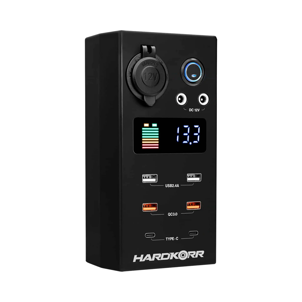 Small Hardkorr 12V DC power distribution box front view with a battery level display, USB ports and covered socket.