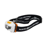 Hardkorr 145 lumen headtorch in an angled view with a white housing, orange button and black headband.