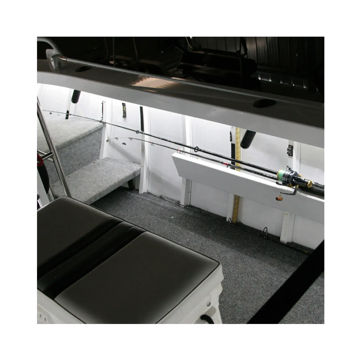 Hardkorr 8m Tri-Colour LED boat lights beneath the side rail, illuminating fishing rod storage in white.