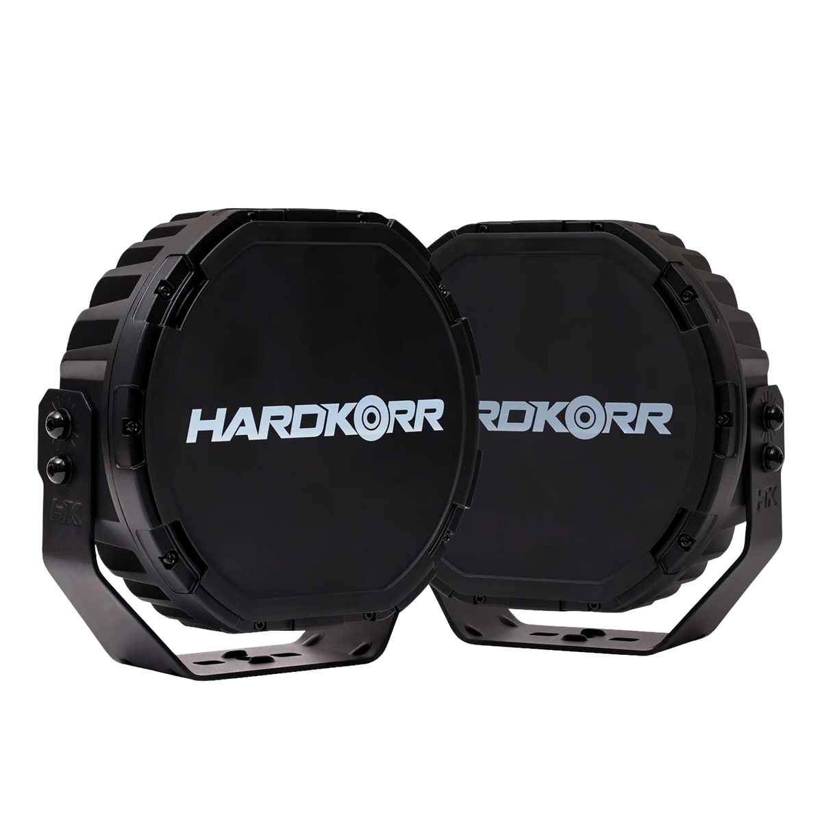 Pair of Hardkorr XD Series 9 inch LED driving lights with branded black covers fitted and mounting brackets below.