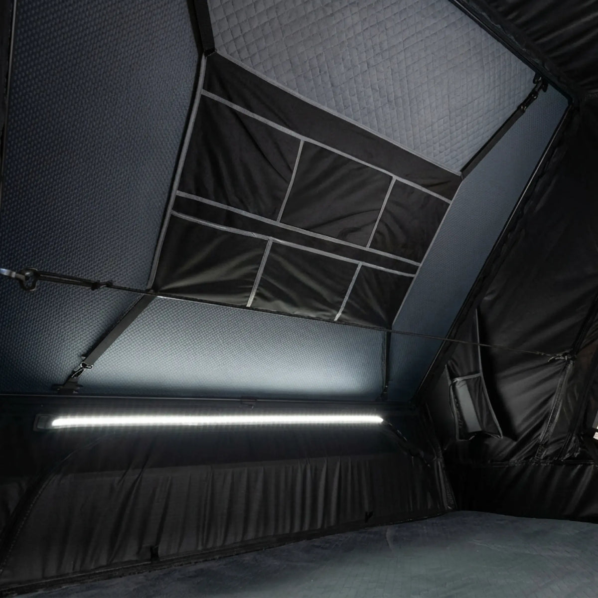 Outback Tourer 1.5 Pro Rooftop Tent interior light strip above the bed area.