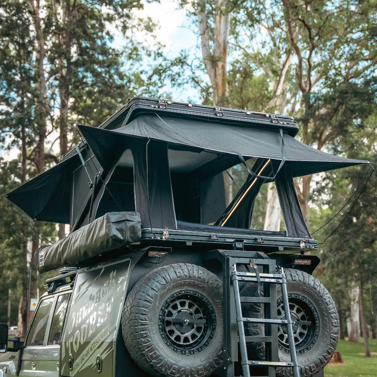 Outback Tourer 1550 Z Rooftop Tent rear open view with rain flys completely open.