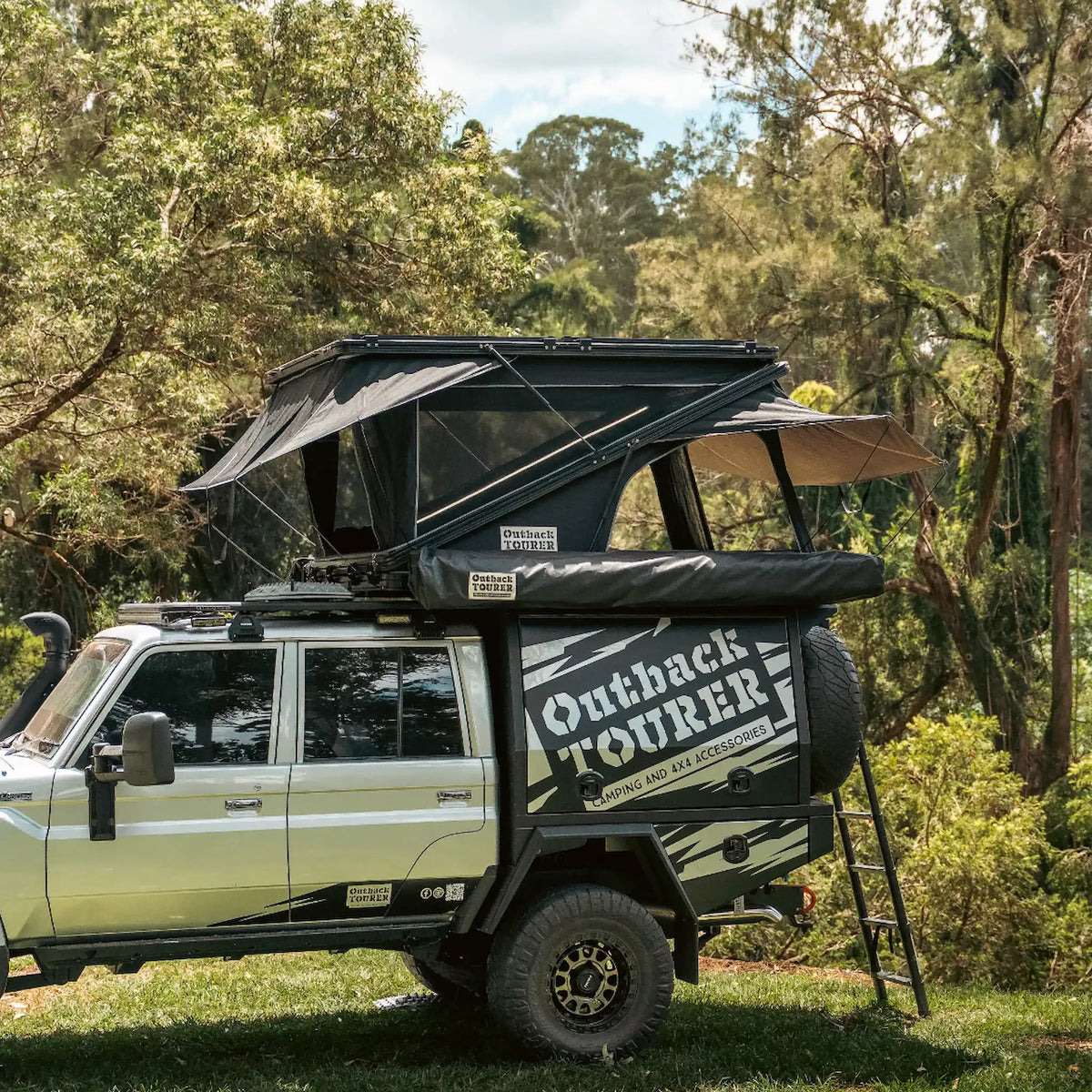 Outback Tourer 1550 Z Rooftop Tent side left installed view on a 79 Landcruiser.