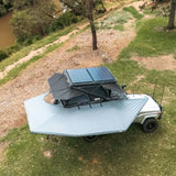 Outback Tourer Drivers Side 270 Plus with D Zipper Awning top right installed view beside a rooftop tent.