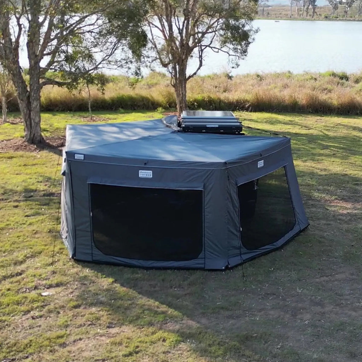 Outback Tourer Passenger Side 270 Full Wall Kit top view with mesh walls beside the ute canopy.