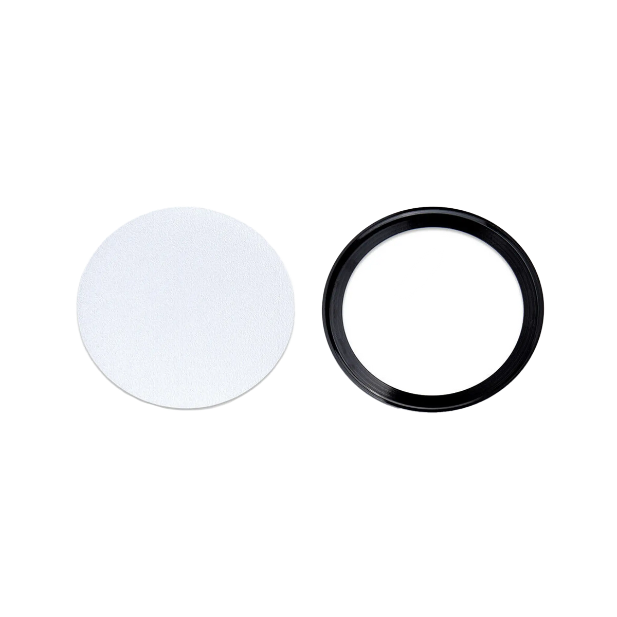 Rekcharge 12V black cool white LED downlight diffuser and black trim ring laid out separately.