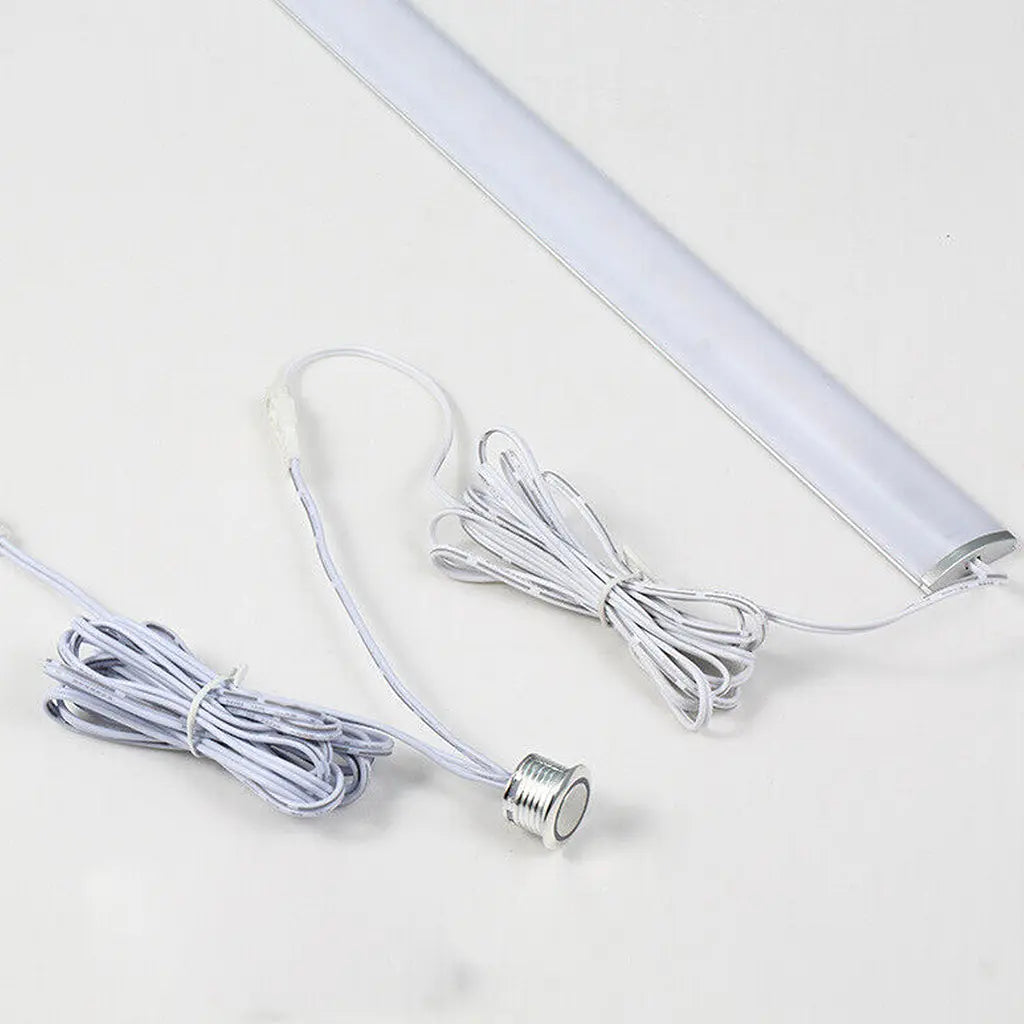 Rekcharge 12V LED touch dimmer switch connected to an LED light bar with white leads.