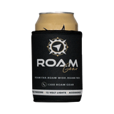 Roam Gear black stubby cooler front view around a can, with the white and gold logo facing forward.