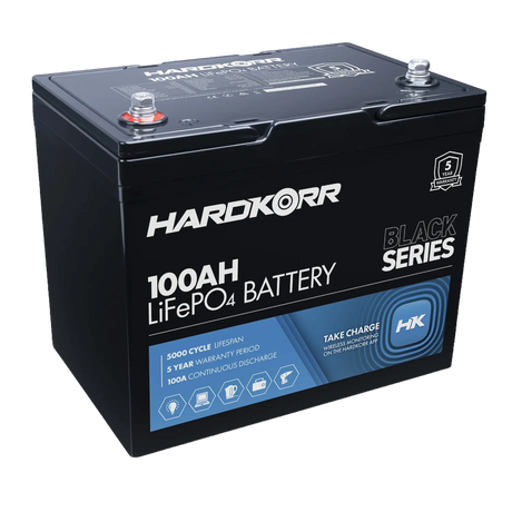 Hardkorr Black 100Ah 12V lithium battery angled top view with terminal posts and front label.