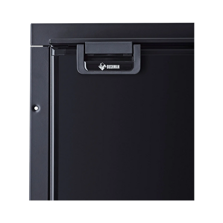 Bushman 130L black upright fridge close up of its black door latch and upper door frame.