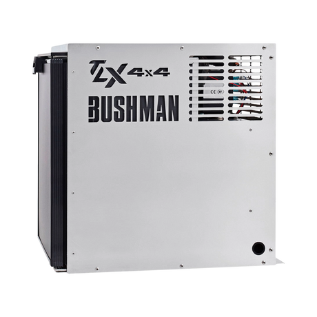 Bushman 65L aluminium fridge box right side view with vent slots and cutout logos beside a black fridge door.