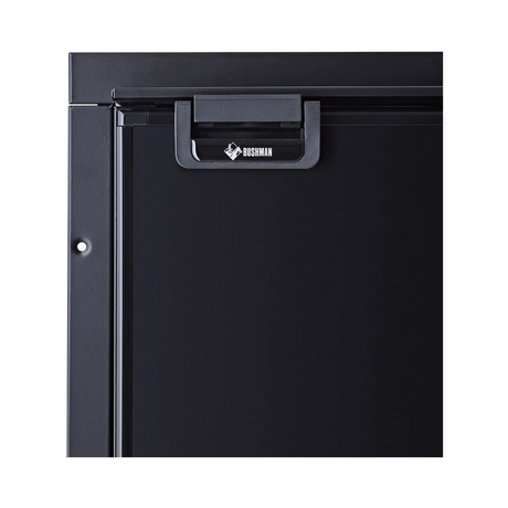 Bushman 85L black upright fridge close up of its black door latch and upper door frame.