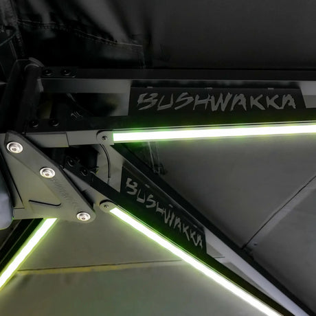 Bushwakka 180 Degree Pro Awning underside hinge arms with green LED light strips.
