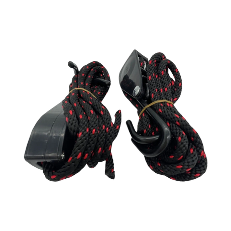 Bushwakka awning ratchet strap pair bundled into coils with the black hooks and ratchets tucked beside the cord.