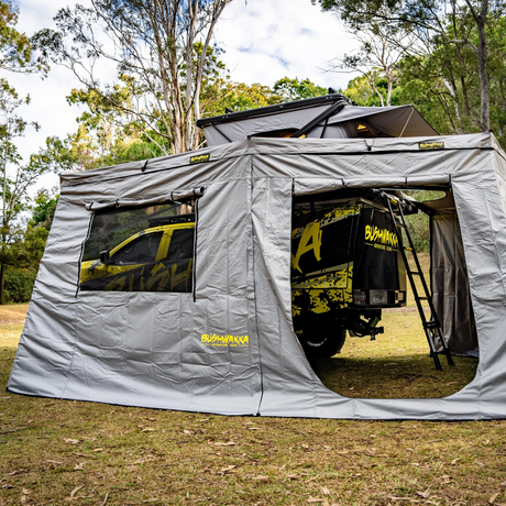 Bushwakka Extreme Darkness awning wall kit rear entrance with a rolled up door and a mesh window beside it.
