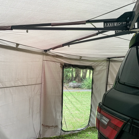 Bushwakka Extreme Darkness awning wall kit interior rear corner with roof supports and an open doorway.