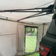 Bushwakka Extreme Darkness awning wall kit interior rear corner with roof supports and an open doorway.