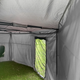 Bushwakka Extreme Darkness awning wall kit interior view showing a mesh door, roof supports and grey walls.