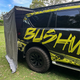 Bushwakka Extreme Darkness awning wall kit side close up with the wall edge beside the rear quarter of a Nissan Patrol.