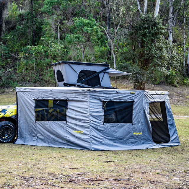 Bushwakka Extreme Darkness awning wall kit installed side view with two mesh windows and a mesh door.