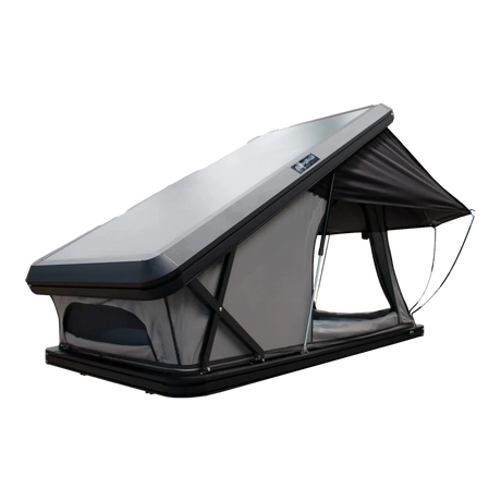 Bushwakka Doghouse rooftop tent front angled view with hinge end, side window and extended rain fly visible.