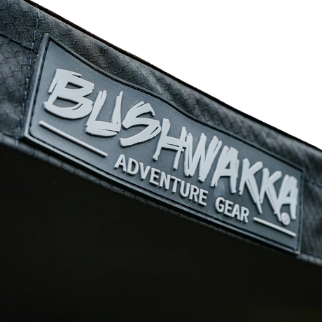 Bushwakka Driver Side XL Squared Pro D-Zip Awning logo patch on awning edge.