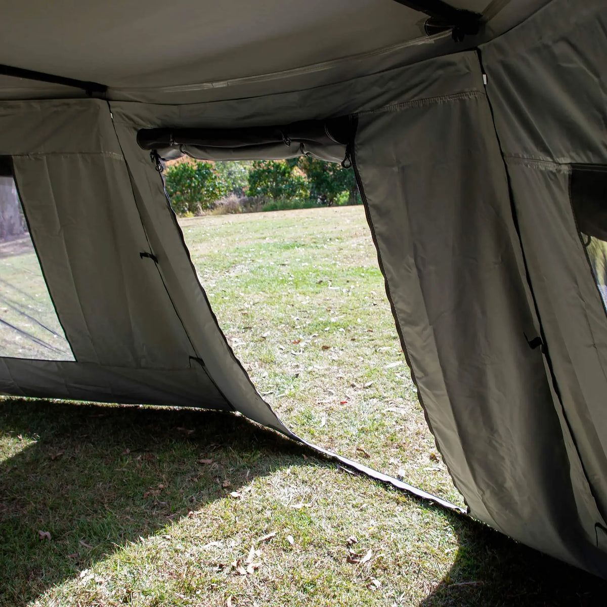 Bushwakka Extreme 180 awning wall kit interior view through the rolled-open doorway.