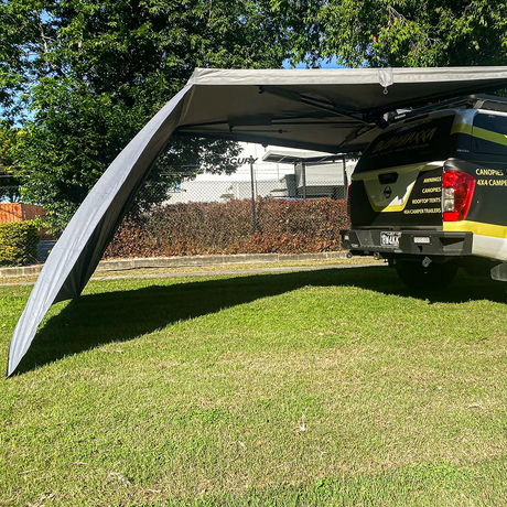 Bushwakka Extreme 180 degree awning wall rear view with the sloping panel beside the tailgate of a 4WD.