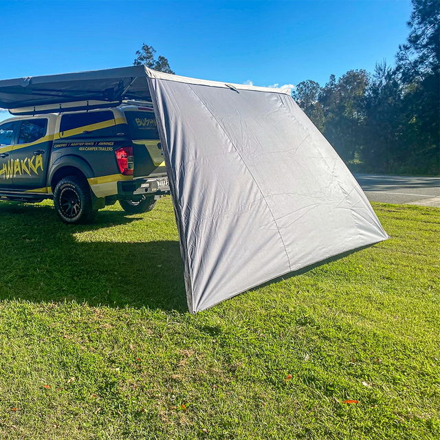 Bushwakka Extreme 180 degree awning wall rear angled exterior view with the grey panel extended to the ground.