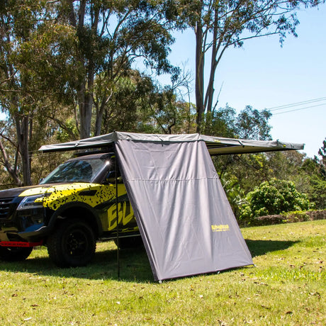 Bushwakka Extreme 2000 mm straight wall front-left installed view beneath a vehicle awning.