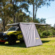 Bushwakka Extreme 2500 mm straight wall front-left installed view beneath a vehicle awning.