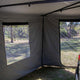 Bushwakka Extreme 270 awning wall kit interior corner with clear windows and open doorway.