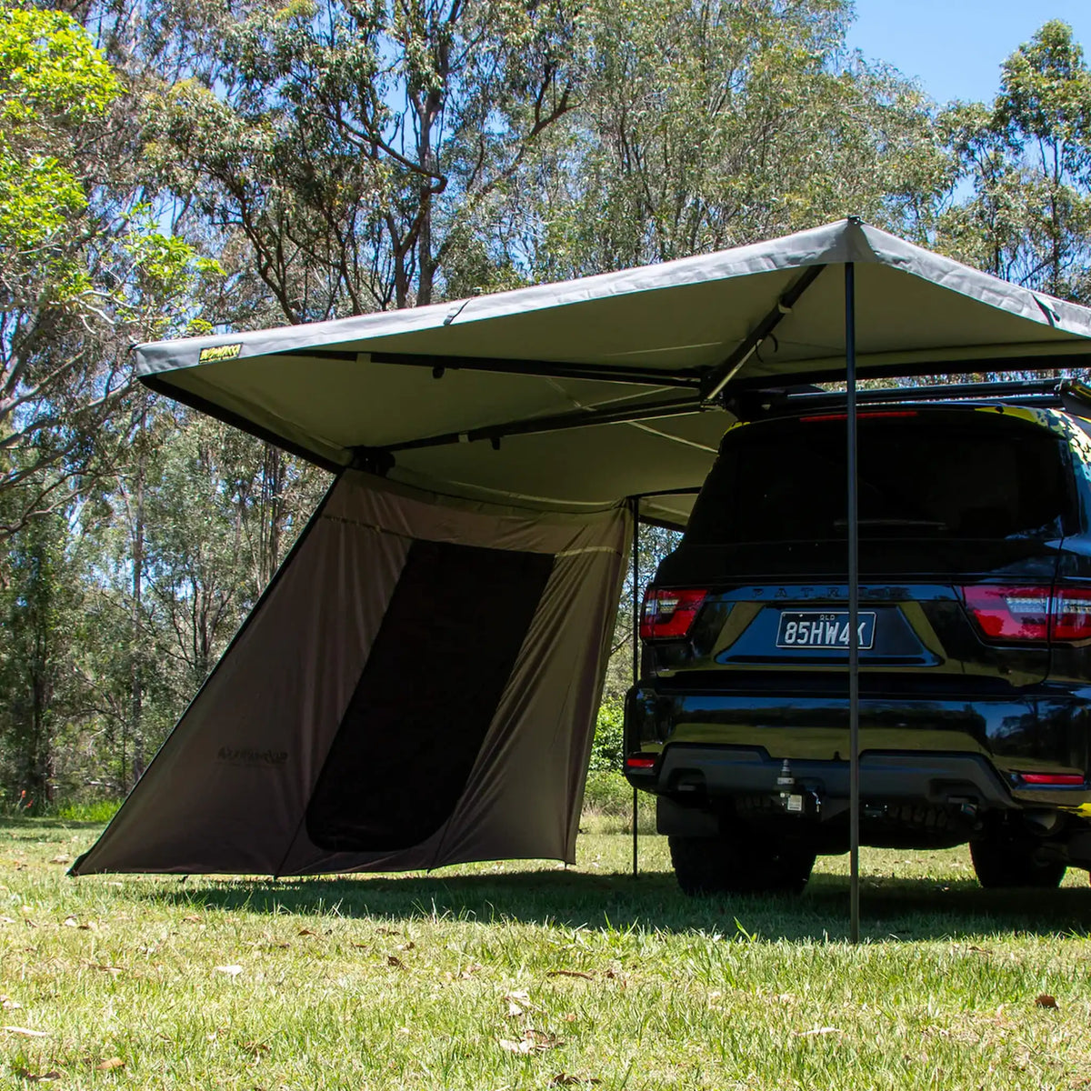 Bushwakka Extreme 270 awning single door wall rear view beside the back of the vehicle.