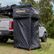 Bushwakka Extreme Shower Ensuite Single set up beside a ute with black walls pegged to the grass.