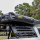 Bushwakka Extreme Shower Ensuite Single packed in its black travel cover on a vehicle roof rack.