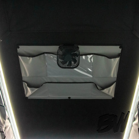 Bushwakka Nomad rooftop tent ceiling storage pocket and hanging fan close up.