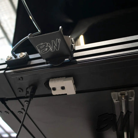 Bushwakka Nomad rooftop tent underside mounting rail, cable and bracket close up.