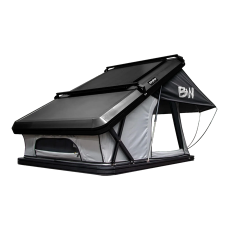 Bushwakka Shack rooftop tent front angled view with the hard shell roof, low front window and open side doorway.