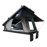 Bushwakka Shack rooftop tent rear angled view with open doors, rain fly on steel poles and hanging shoe bags.