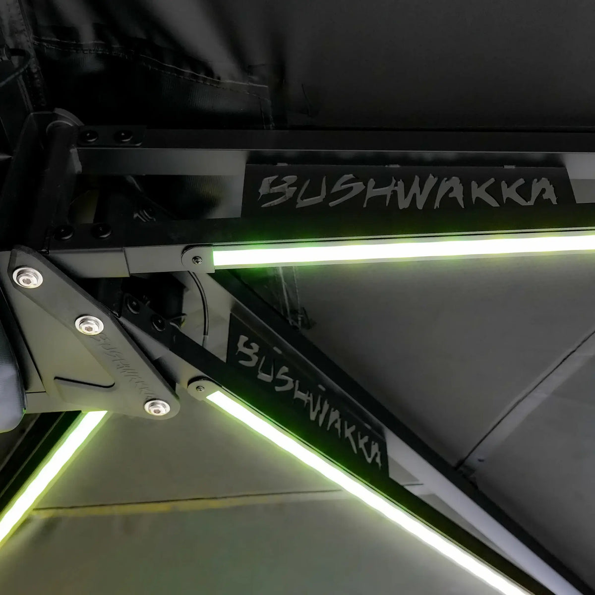Bushwakka Square 2.5m Pro Awning underside hinge arms with green LED light strips.