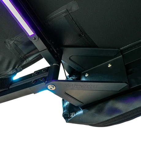 Bushwakka Square 2.5m Pro Awning hinge detail with purple LED light and black pivot bracket.