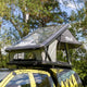 Bushwakka Stellar rooftop tent front view with the clear roof raised above the vehicle.