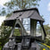 Bushwakka Stellar rooftop tent rear view with the rain fly extended above the entrance and ladder.