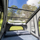 Bushwakka Stellar rooftop tent interior angled view of the clear roof above the pillows and front window.