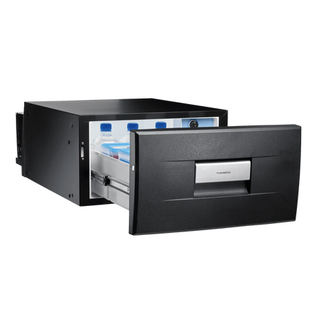 Dometic 30L drawer fridge/freezer open front view with bottles and containers inside.