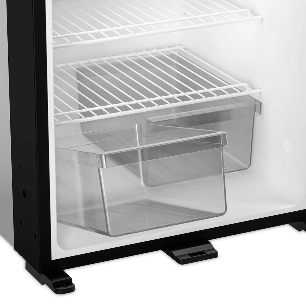 Dometic NRX 60 upright fridge lower interior view with empty wire shelves and empty clear bottom drawers.